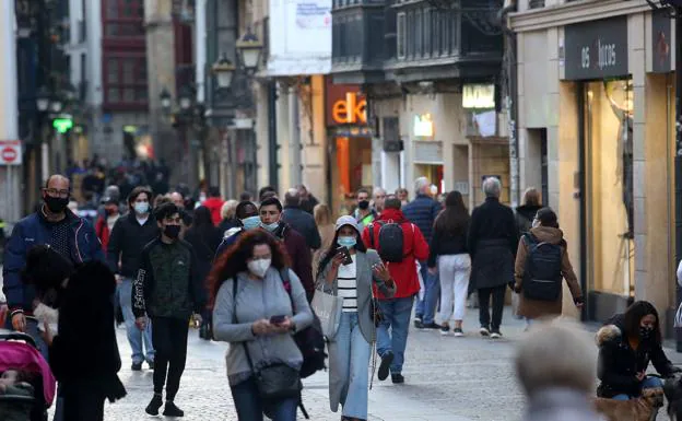 Pedestrians on a Bilbao street. 