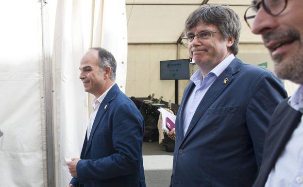 Jordi Turull y Carles Puigdemont, en el congreso de Junts de junio./EP