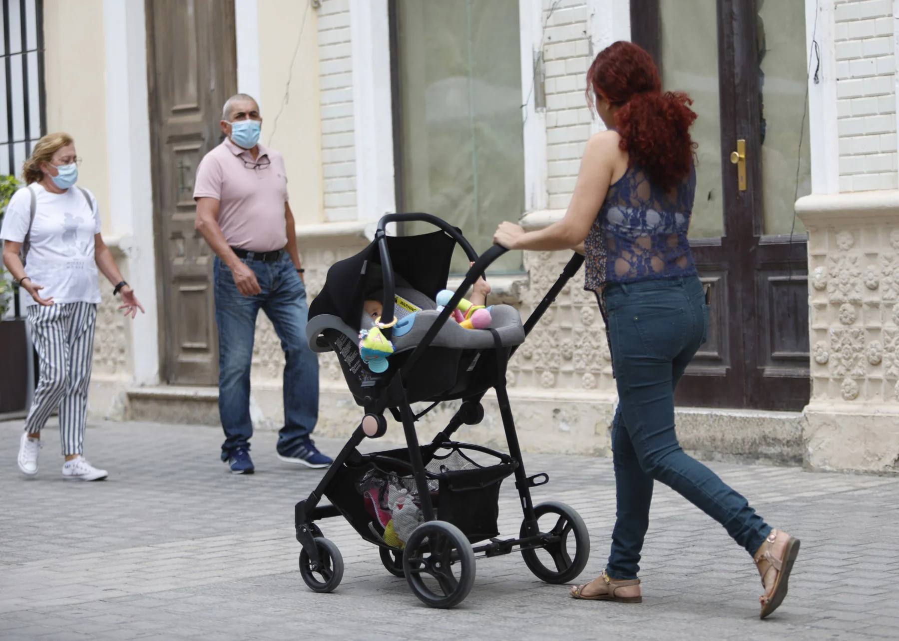 File photo of a woman walking with a baby in Arrecife. 